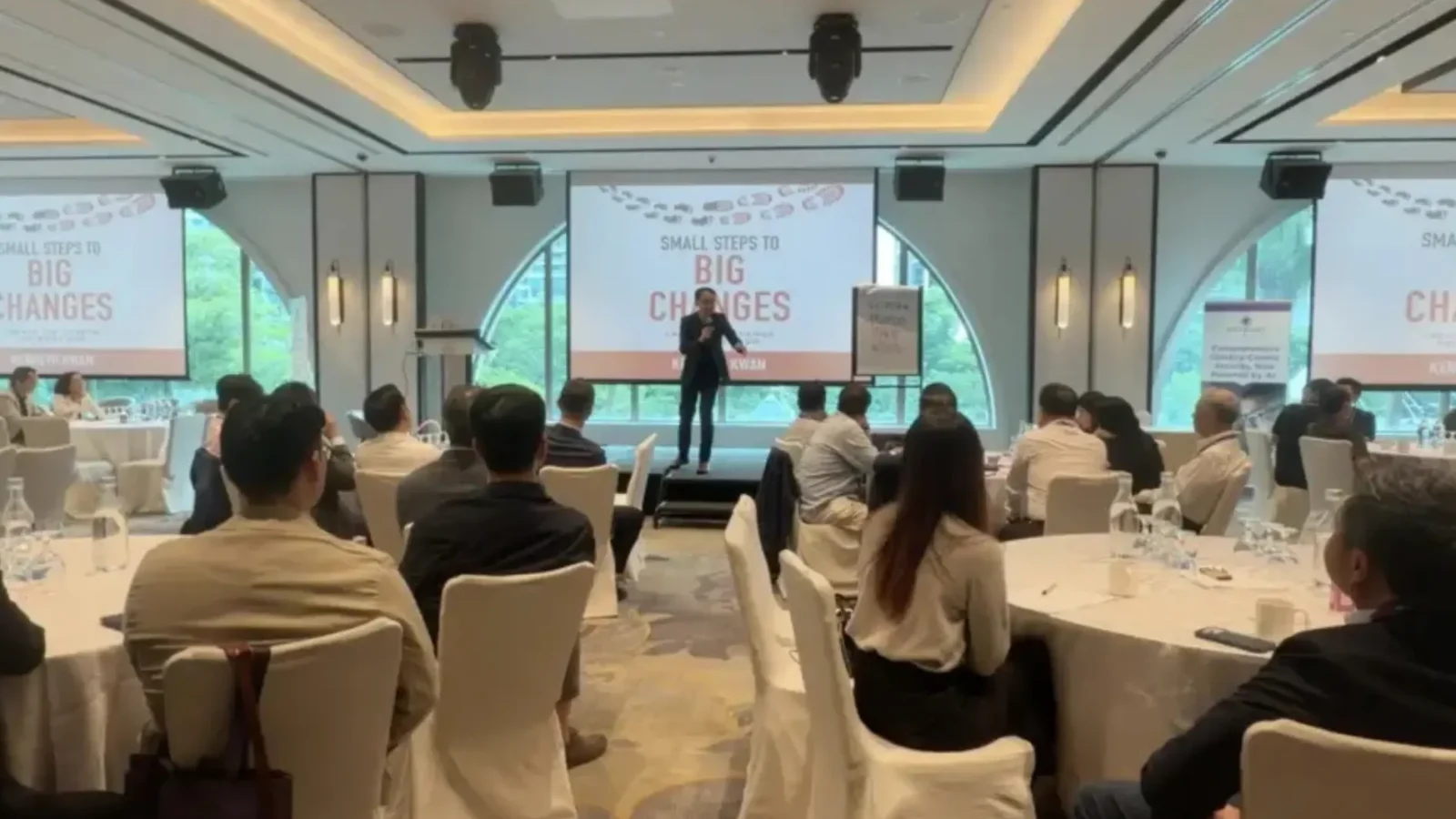 Business keynote speaker Kenneth Kwan delivering a results-focused keynote to corporate leaders